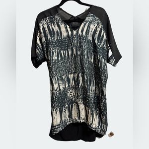 Zara Shirt.  V neck. Basic T Shirt Special addition. Size Medium.It’s not cotton